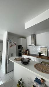 Appartements Appartement de L : photos des chambres