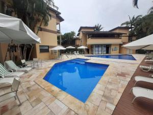 Riviera de São Lourenço Apto Completo com Churrasqueira Serviço de Praia Piscina aquecida Sauna salão de jogos e quadra