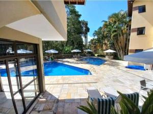 Riviera de São Lourenço Apto Completo com Churrasqueira Serviço de Praia Piscina aquecida Sauna salão de jogos e quadra