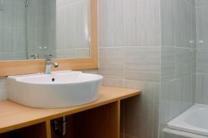 Comfort 1BR at Vasanta Innopark Apartment By Travelio