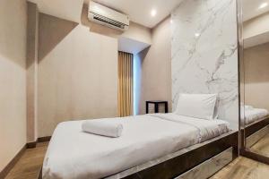 Cozy Stay 2BR Branz BSD City Apartment near AEON Mall By Travelio