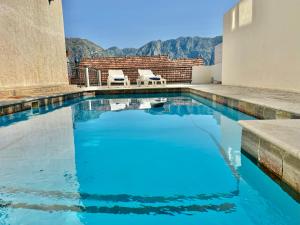 Prcanj sunny port apartments with shared pool