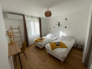 Maisons de vacances L Auvetia - 150 m du circuit des 24h : photos des chambres