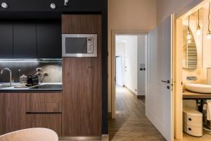 Eco Chic room with sofa bed and kitchen by Design Club Collection