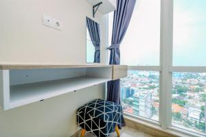 Modern Look and Comfy 2BR at Menteng Park Apartment By Travelio