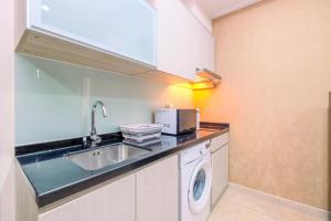 Modern Look and Comfy 2BR at Menteng Park Apartment By Travelio