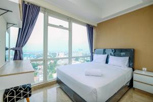 Modern Look and Comfy 2BR at Menteng Park Apartment By Travelio