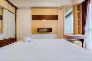 Homey and Simply 1BR M-Town Signature Apartment By Travelio