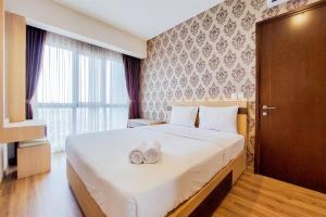 Homey and Simply 1BR M-Town Signature Apartment By Travelio
