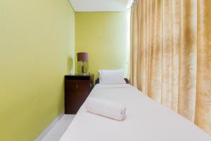 Comfort 2BR at Brooklyn Alam Sutera Apartment By Travelio
