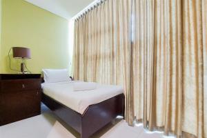 Comfort 2BR at Brooklyn Alam Sutera Apartment By Travelio