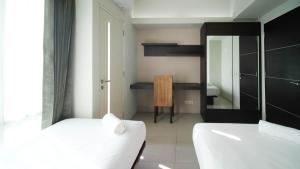 Cozy Stay 2BR at The Square Surabaya Apartment By Travelio