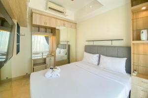 Nice and Elegant 2BR at Menteng Park Apartment By Travelio
