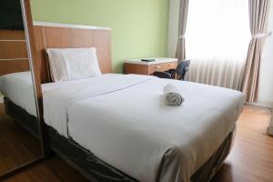 Minimalist Studio at Easton Park Residence Jatinangor Apartment By Travelio