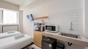 Restful Studio (No Kitchen) Apartment at Bandaraya - Tallasa City Makassar By Travelio