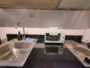 1BR Condotel with Balcony at FAME Residences #FM54