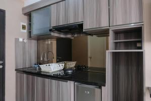 Spacious Studio with Extra Room at Grand Asia Afrika Apartment By Travelio
