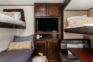 RV located on private property, providing access to the Guadalupe River, accommodates up to 7 guests