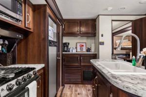 RV located on private property, providing access to the Guadalupe River, accommodates up to 7 guests