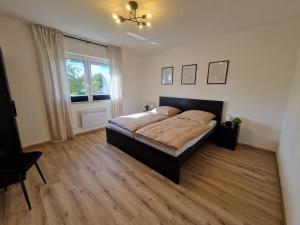 Ferienwohnung am See - Obergeschoss - Ruhige Lage - Eigener Garten