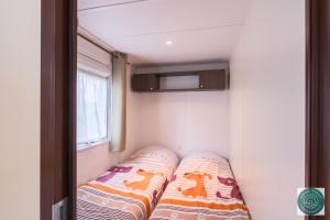 Appartements Petit cocon ensoleille, le mobil-home Alele : photos des chambres