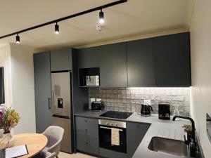 Stylish 1-Full Bedroom Apartment with a separate Living Room, Workspace and Kitchen close to the beach and V&A in Cape Town