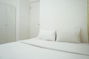 Comfy and Furnished 2BR Bassura City Apartment near Mall By Travelio