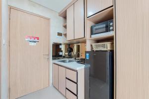 Cozy Stay Studio Room Apartment at B Residence By Travelio