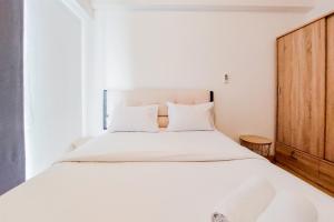 Spacious and Comfortable 2BR at Sky House BSD Apartment By Travelio