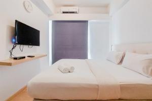 Spacious and Comfortable 2BR at Sky House BSD Apartment By Travelio