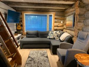 Kaupinpirtti, Ylläs, Äkäslompolo, , Lapland - Silver Log Cabin with Lake and Fell Scenery