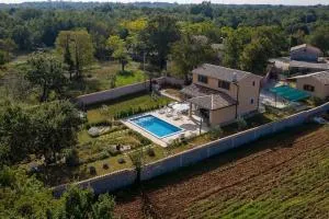 Nice holiday houses with Mediterranean garden - Divšići