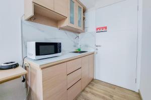 Homey Studio (No Kitchen) Urbantown Serpong Apartment By Travelio