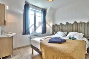 Appartements LocaLise - C02 - Vue mer - Balcon - Plage juste a cote - Centre et port a pied - Wifi inclus - Draps inclus - Animaux bienvenus : photos des chambres