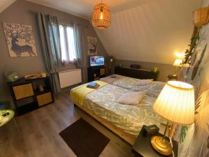 Sejours chez l'habitant Gite au Charme de la Foret Circuit des 25 Bosses : photos des chambres