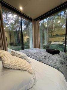 Telise TinyOne is a modern forest cabin with a cozy hot tub