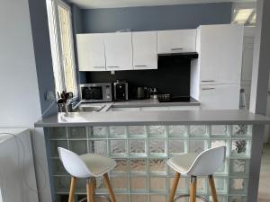 Maisons de vacances Maison les pieds dans le sable : photos des chambres