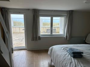 Maisons de vacances Maison les pieds dans le sable : photos des chambres