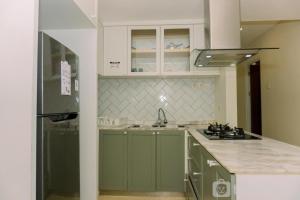 Great Deal 2BR Apartment Springhill Terrace Residence By Travelio