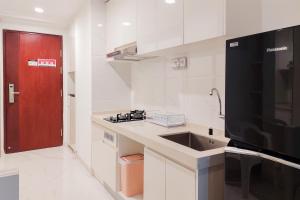 Homey Studio Room at Sky House BSD Apartment By Travelio
