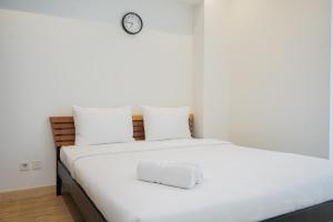 Cozy and Spacious 1BR Apartment at Branz BSD City By Travelio