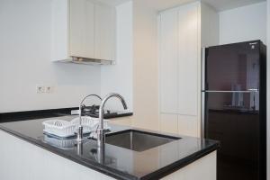Cozy and Spacious 1BR Apartment at Branz BSD City By Travelio