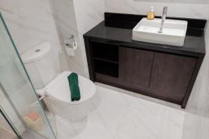 Cozy and Spacious 1BR Apartment at Branz BSD City By Travelio