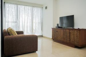 Cozy and Spacious 1BR Apartment at Branz BSD City By Travelio