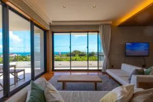 オーシャンビューの新築インテリアデザインを貸切!!テラス付きの宿で最高の休日をお楽しみください - Bora