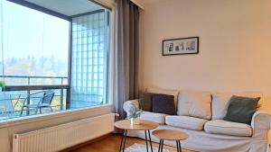 Kotimaailma Apartments - saunallinen kaksio koskinäkymällä - Verstaankatu