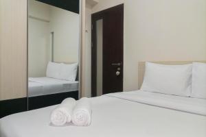 1BR with Cozy Design at Uttara The Icon Apartment By Travelio