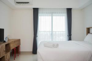 Nice and Homey Studio at Bintaro Embarcadero Apartment By Travelio