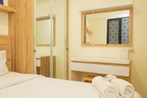 Cozy Living and Tidy 1BR Meikarta Apartment By Travelio