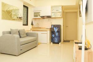 Cozy Living and Tidy 1BR Meikarta Apartment By Travelio